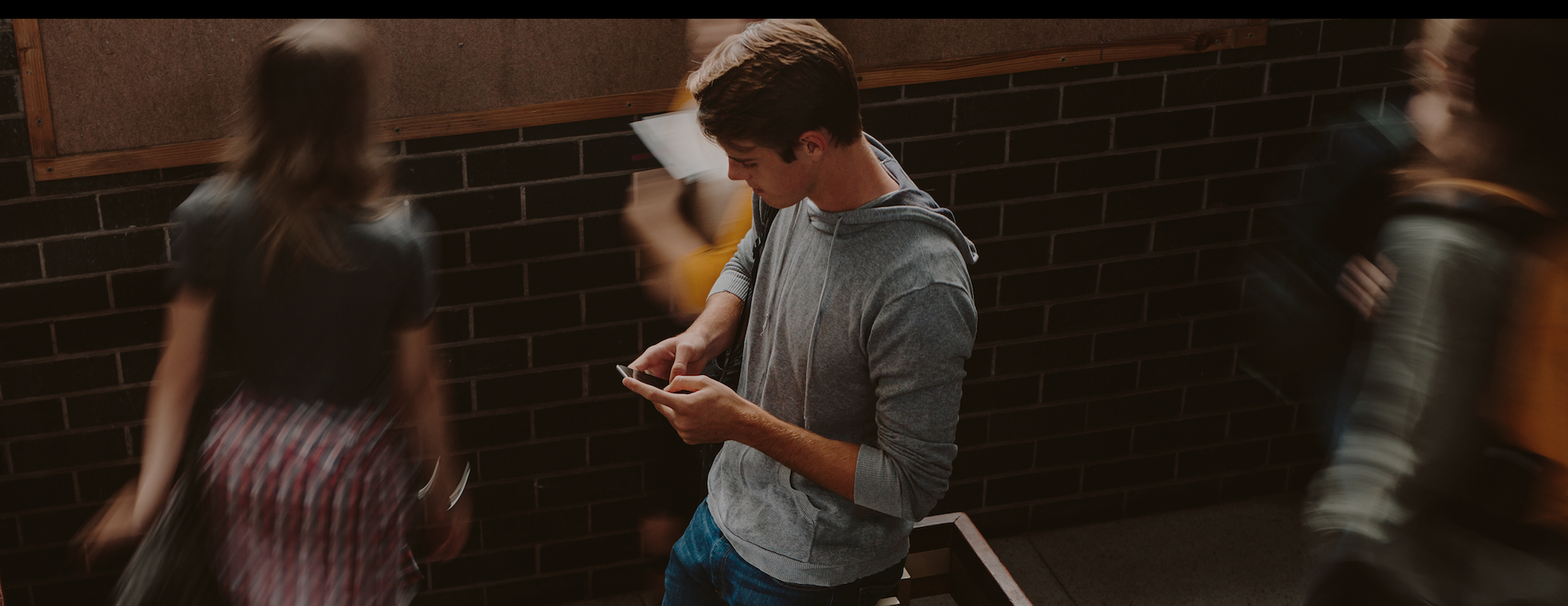 Boy on phone in school