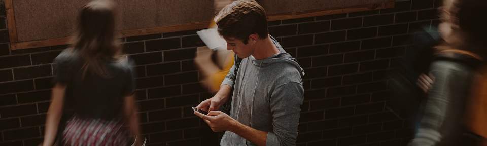 Boy on phone in school